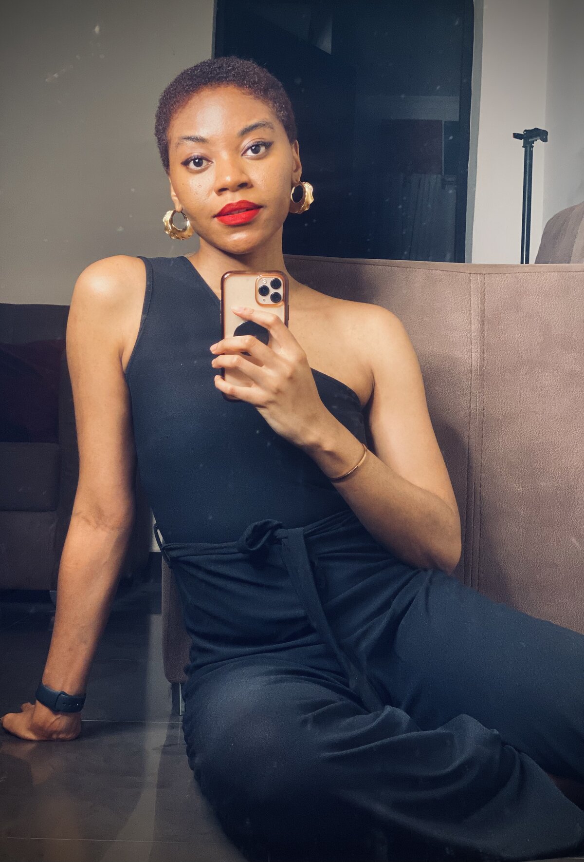 Daisy after the big chop - short natural hair, red lip, in a black dress